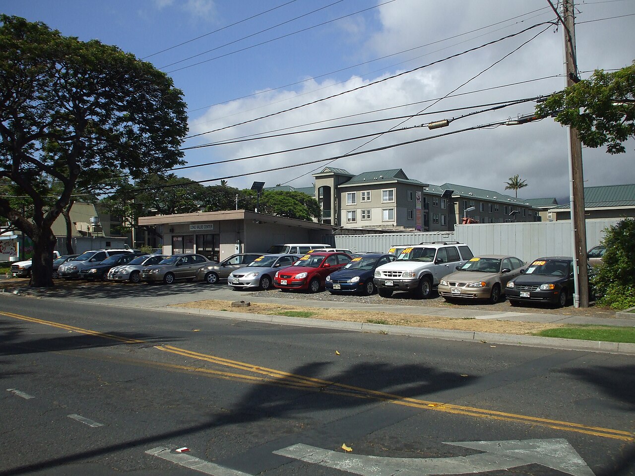 A used car lot with vehicles displayed for sale